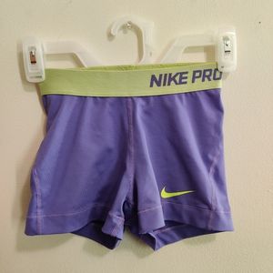 Purple and green Nike Pro shorts